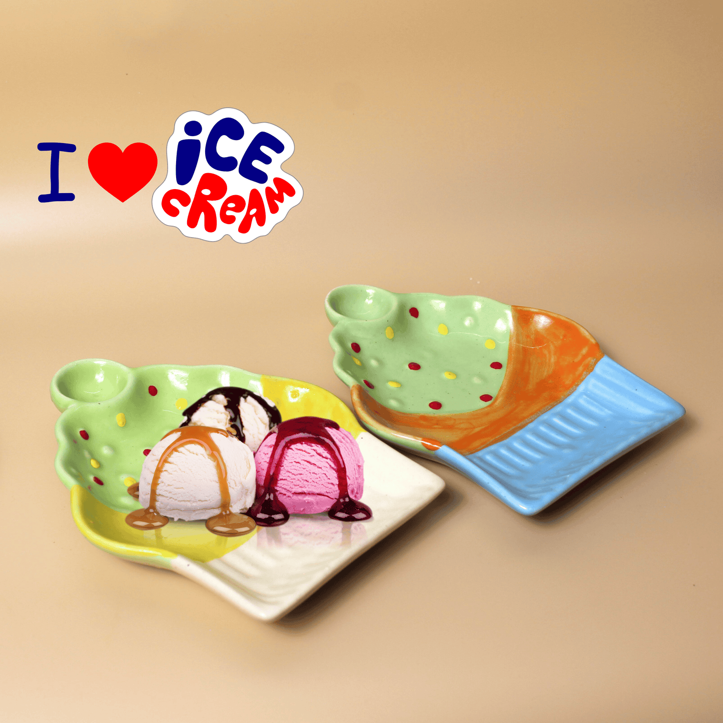 A set of two ceramic platters designed to resemble cups of ice cream, one with a scoop of ice cream on top. The background has a phrase 'I ❤️ ICE CREAM'.