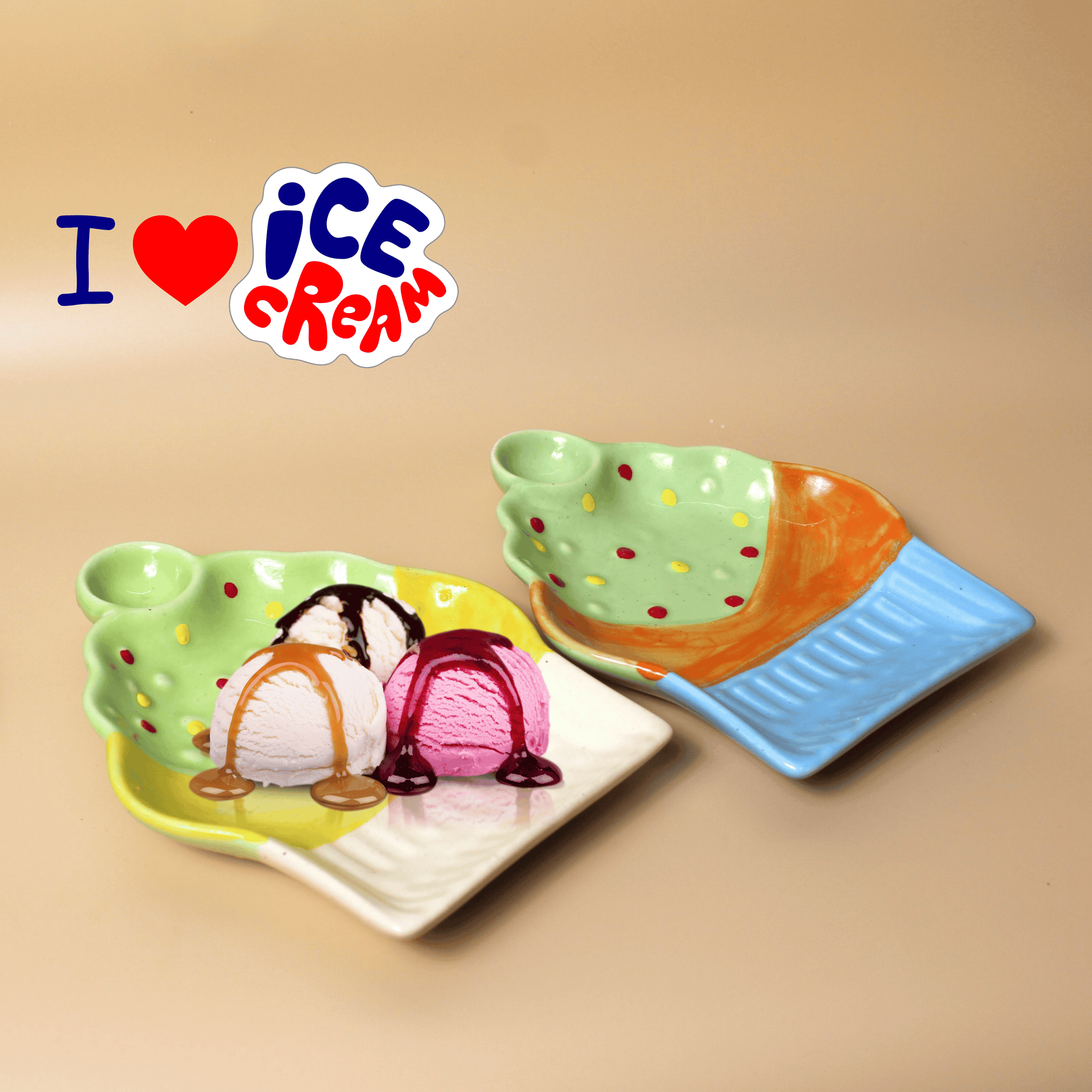 A set of two ceramic platters designed to resemble cups of ice cream, one with a scoop of ice cream on top. The background has a phrase 'I ❤️ ICE CREAM'.