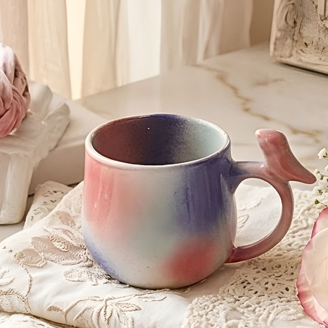 Multicolored ceramic mug on a textured surface with soft lighting